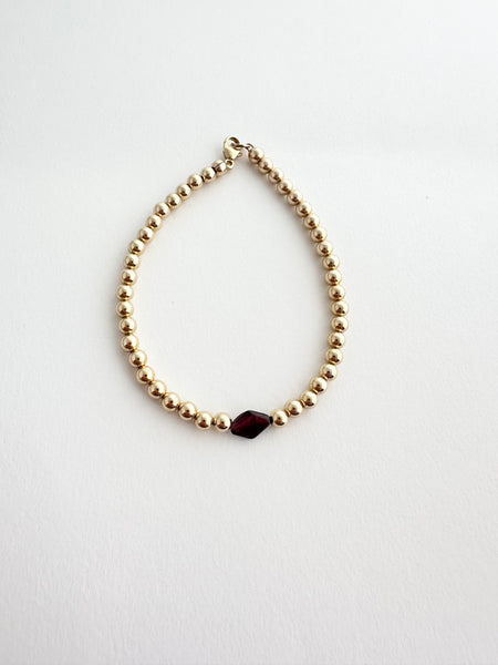 14k gold filled ball  + single garnet diamond shaped bracelet